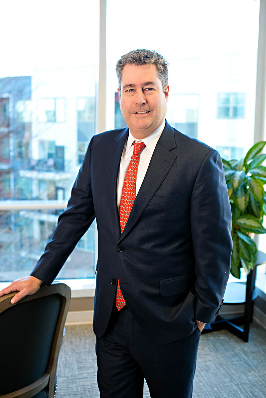 Jon Hedgepeth standing in a conference room