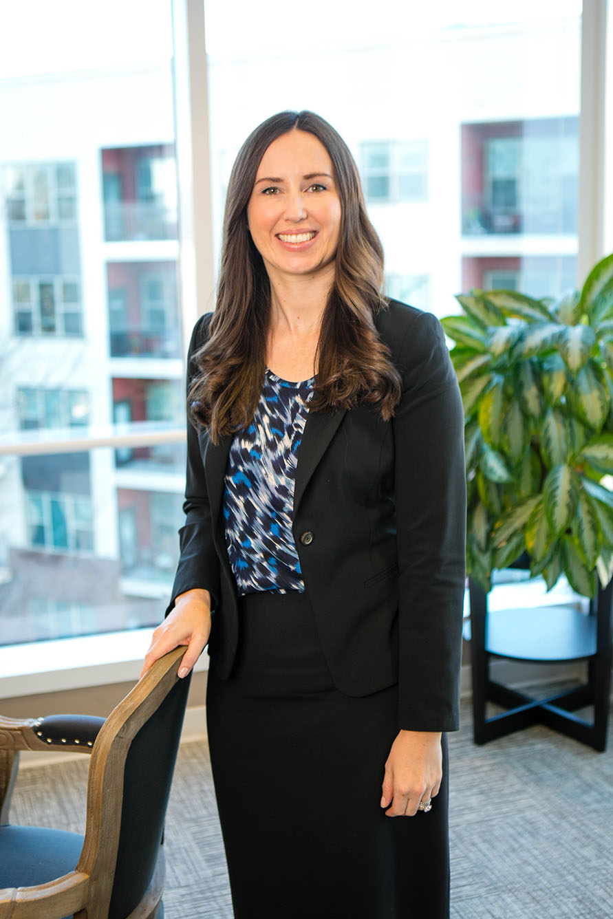 Emily Giovinazzo standing in a conference room